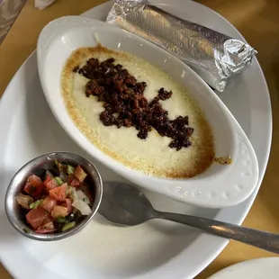 Queso fundido, didn&apos;t see it on the menu but our waitress offered it to us. It was $11.99 with chrorizo added. Comes with flour tortillas.