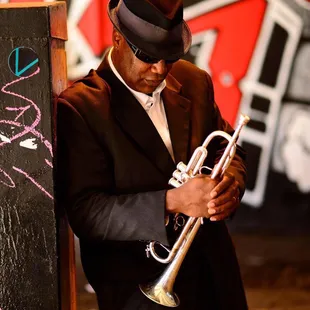 a man playing a trumpet