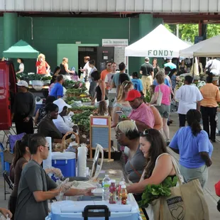 a crowd of people shopping