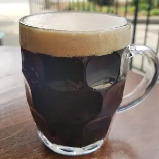 a glass of beer on a table
