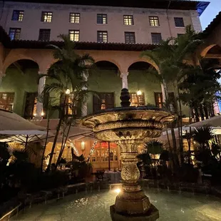 a fountain in front of a building