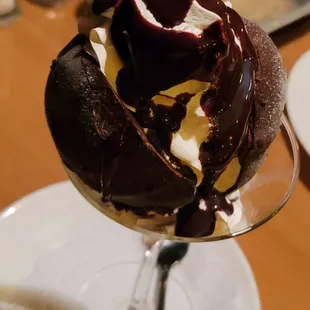 Bomba - Classic vanilla and chocolate gelato, caramel center, almonds, chocolate coating - January 2025. HUGE DESSERT.