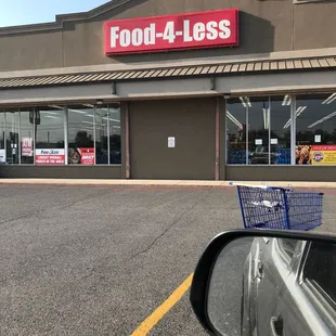 a shopping cart in front of a store