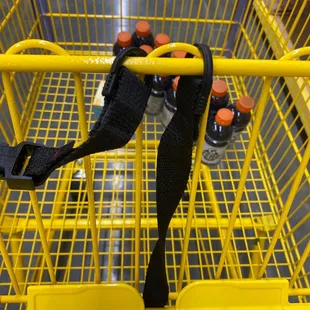 a yellow shopping cart filled with food