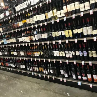 a large wine rack in a grocery store