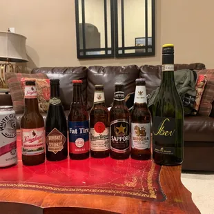 a variety of beer bottles on a table