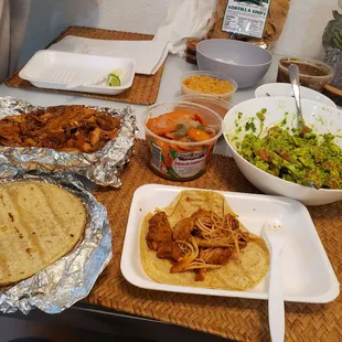 Feast for 4! Carrots purchased separately along with big salsa tub. Guac was homemade.  Great meal for 19 bucks.