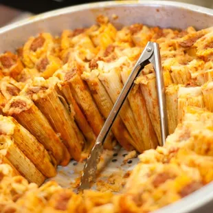 a casserole dish with a serving utensil