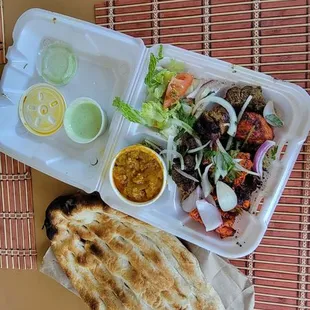 Take out! 1 of 3 meals. Delicious lunch combo. Chicken and lamb. Comes with rice salad, bread and a side. Our favorite I eggplant!