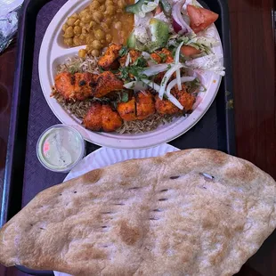 a plate of food on a tray