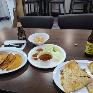 Birrria! L-R Birria Taco Plate, birria eggrolls, birria Quesadilla.