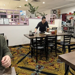 The waiter, who ran the entire restaurant by himself, and did an amazing job