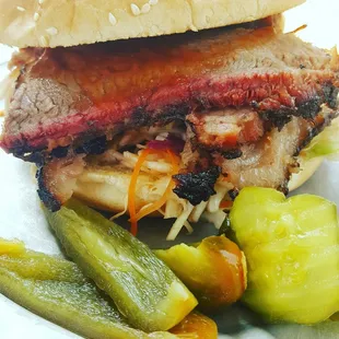 a pulled pork sandwich with pickles
