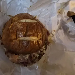 Grease in flat pretzel bun