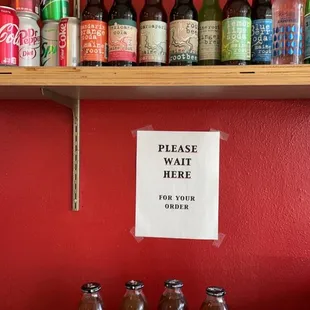 a variety of beverages on a shelf