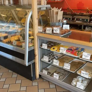 a display case of donuts and pastries