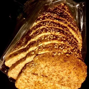 A loaf of "Ezekiel 4:9" Sesame. Flourless bread with wholesome whole-grain texture.