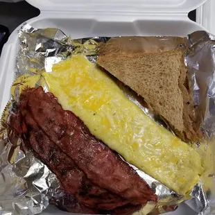 a breakfast in a styrofoam container