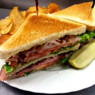 FFT Club - Double-decked ham, turkey, bacon, lettuce, tomato and mayonnaise on white toast