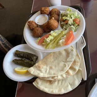 Falafel plate and stuffed grape leaves.