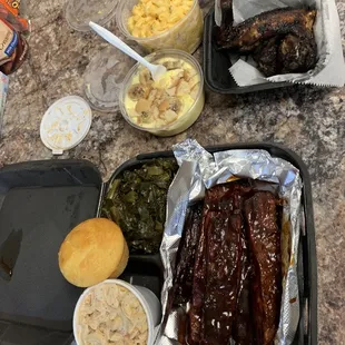 Jerk chicken , ribs, Mac n cheese, banana pudding, greens &amp; seafood salad...