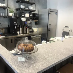 Clean, modern prep area with seats at the bar