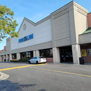 a car parked in front of the store