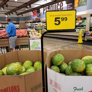 two boxes of watermelons in a grocery store