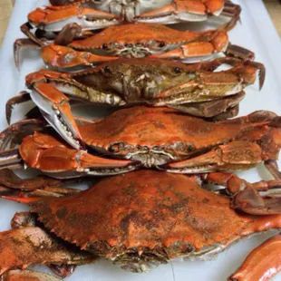a bunch of crabs on a cutting board
