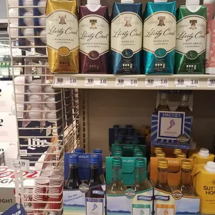 a variety of beverages on a shelf