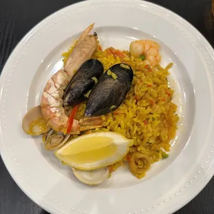 a plate of seafood and rice