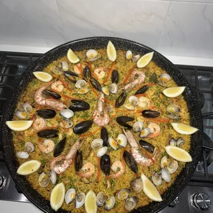 a pan of seafood and rice