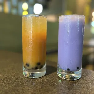 Mango and bourbon boba milk tea, and taro and rum boba milk tea.