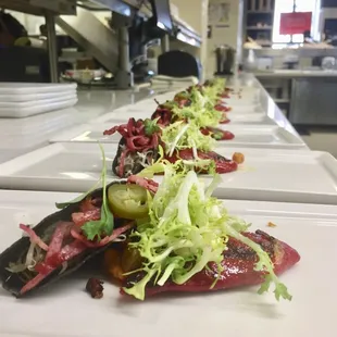 Eloisa prepares their dish for guests on the Taste of Santa Fe!