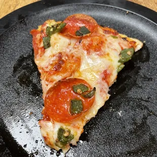 Green chili pepperoni pizza. I think I am going to put green chilis on my pizza back home from now on