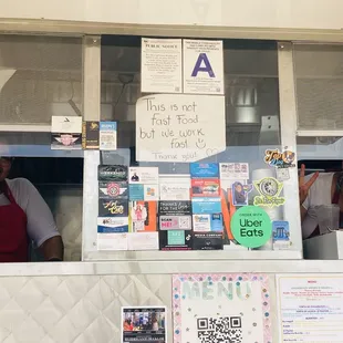 Miss Chilaquiles order window with happy smiles
