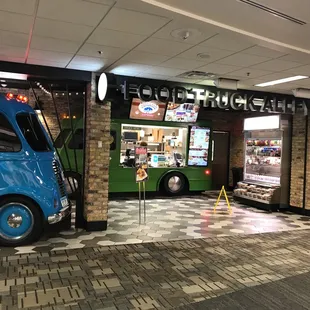 a food truck parked in front of a store