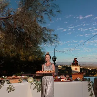 a woman holding a tray of food