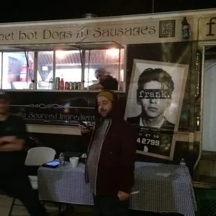 a man standing in front of a food truck