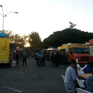 food trucks lined up in a parking lot