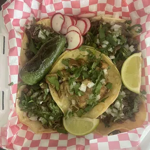 Tacos de tripa, taco de barbacoa and 3 tacos de asada