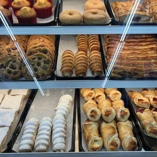 pastry counter in grocery. No prices are posted, making selection difficult