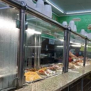 Many bins from which to select hot Caribbean dishes
