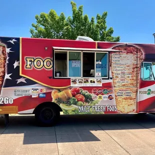 a food truck parked in a parking lot