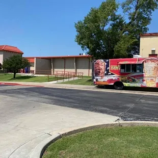 a food truck parked on the side of the road