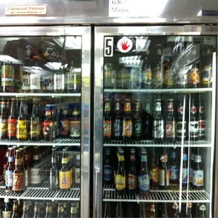 a refrigerator full of beer bottles