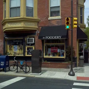 a street corner with a bicycle parked in front of it