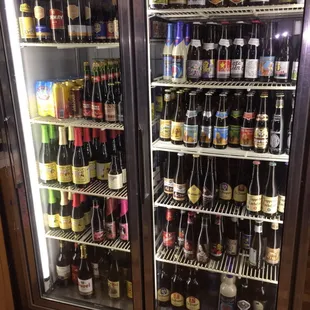 a refrigerator full of beer bottles