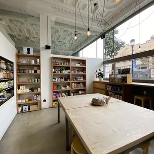 a table and shelves in a store
