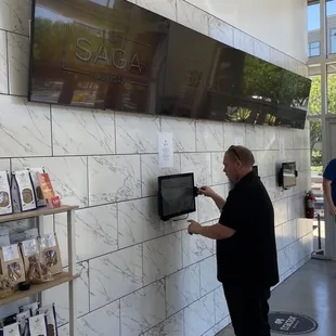 Order from the screens and pick up your food.